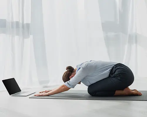 Member of staff performs exercise given by Wellbeing Coach and Counsellor